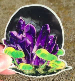 Glowing green mushrooms surround dark purple amethyst on this glow in the dark vinyl sticker