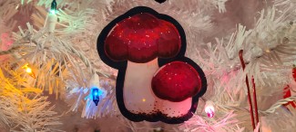 Mushroom Dark Forest acrylic ornament in a white Christmas tree